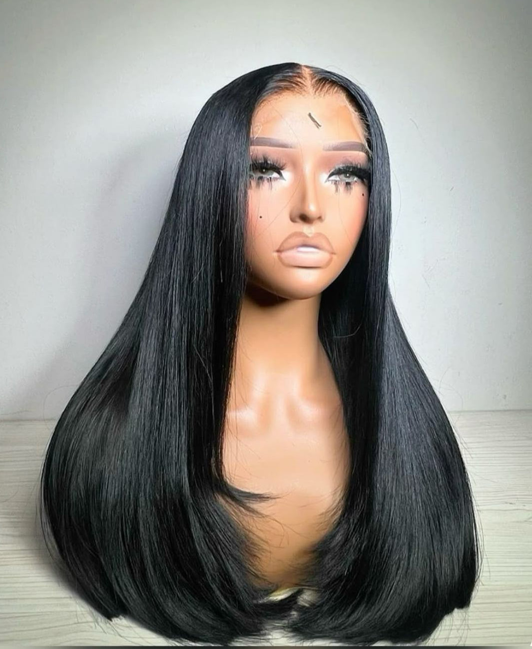 Straight transparent lace human hair wig with full volume and sleek shine